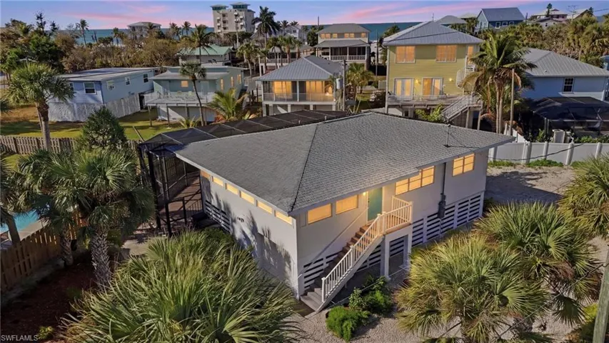 Aerial view of elevated home just steps to Gulf waters and beach - Virtually Edited Image