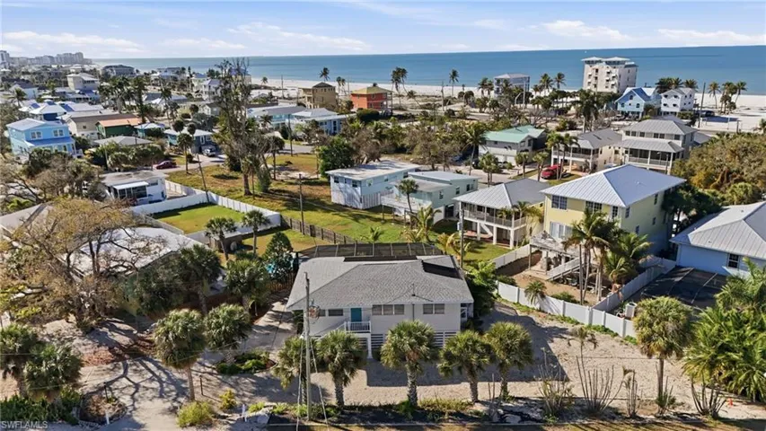 Aerial perspective of home with Gulf views- Virtually Edited Image