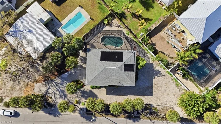 Bird's eye view of a home & pool - Virtually Edited Image