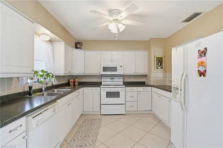 Open kitchen area with tons of natural light - Virtually Edited Image