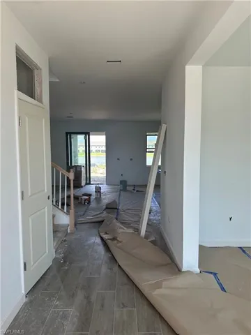 Corridor featuring dark hardwood / wood-style flooring