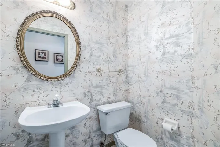 Powder room off den and living room