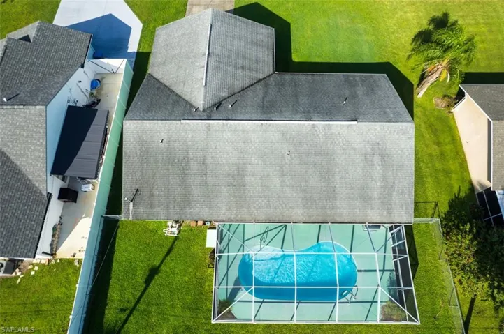 View of subject property featuring a pool