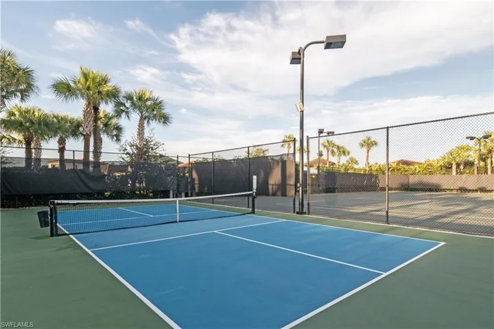 View of tennis court featuring community basketball court