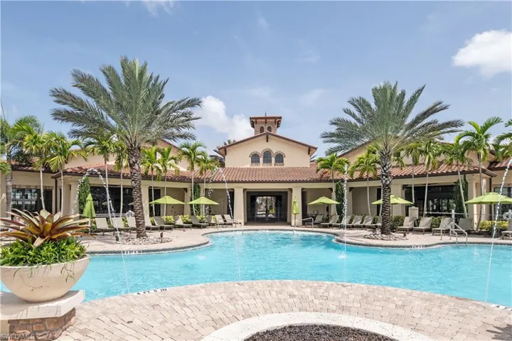 Community pool with a patio