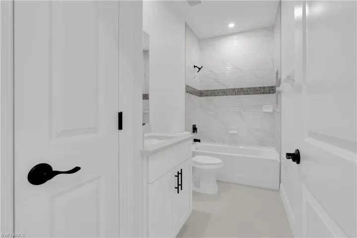 Full bathroom with vanity and shower / bath combination