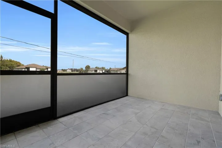 Balcony featuring a sunroom