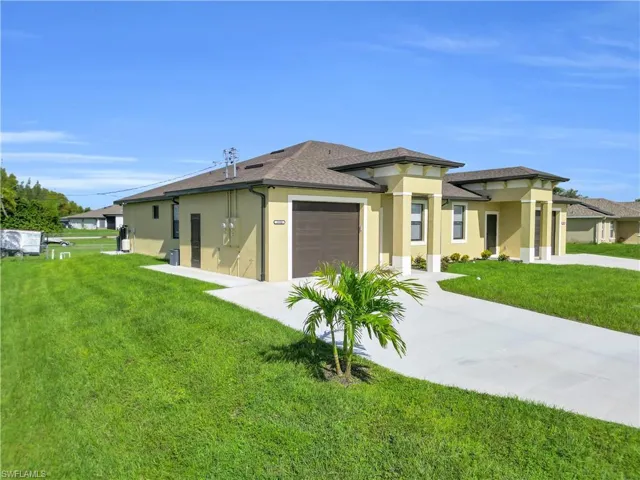 View of property exterior with stucco siding, a lawn, concrete driveway, a garage, and roof with shingles