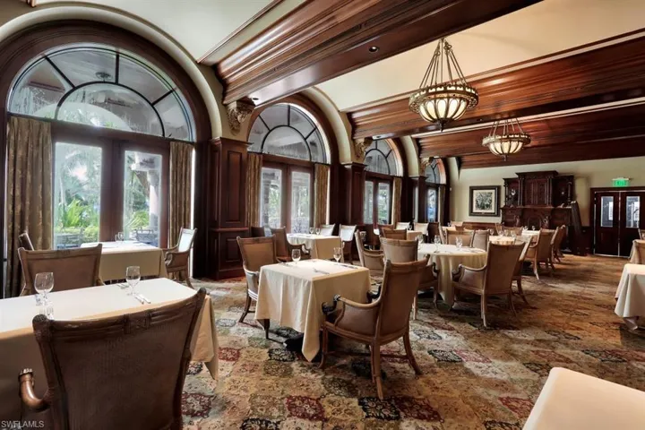 Dining space featuring french doors, a chandelier, and ornamental molding