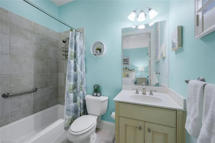 Full bathroom featuring vanity, toilet, and shower / tub combo