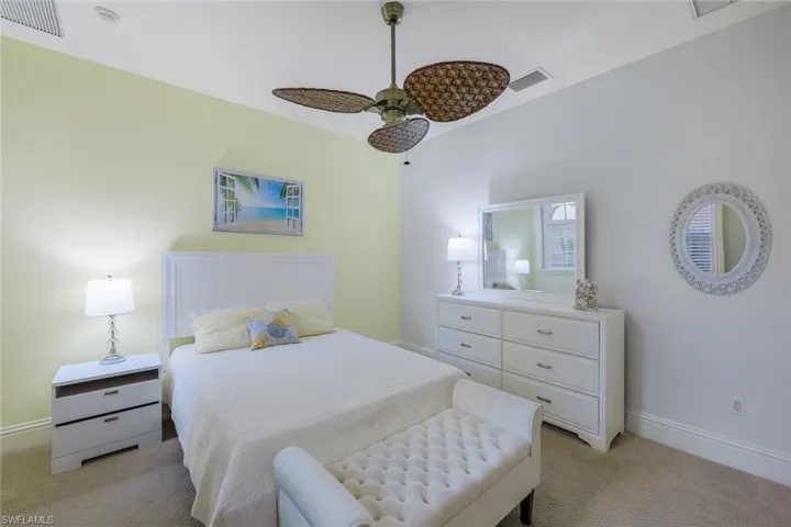 Bedroom featuring ceiling fan and light carpet