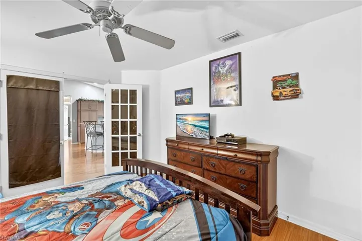 Bedroom featuring wood finished floors and ceiling fan