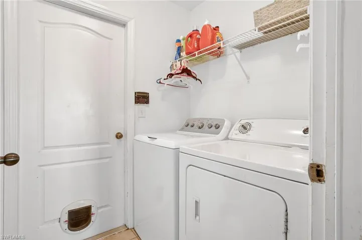 Laundry area with washer and clothes dryer