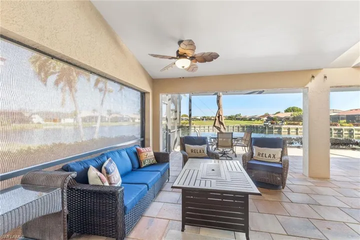 Lanai with screen shutter firepit TV view of #17