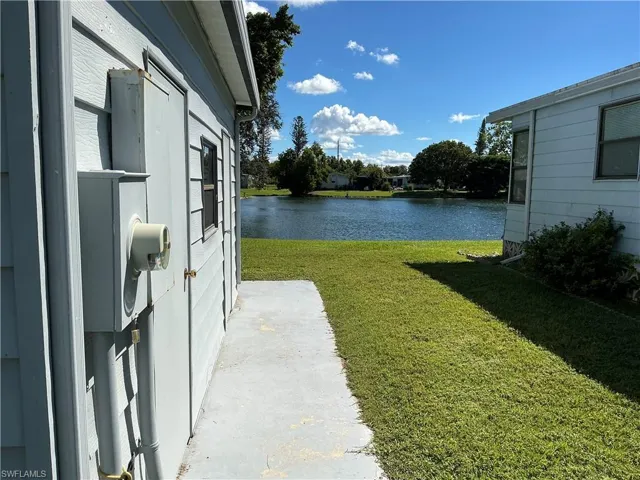 View of green lawn with a water view