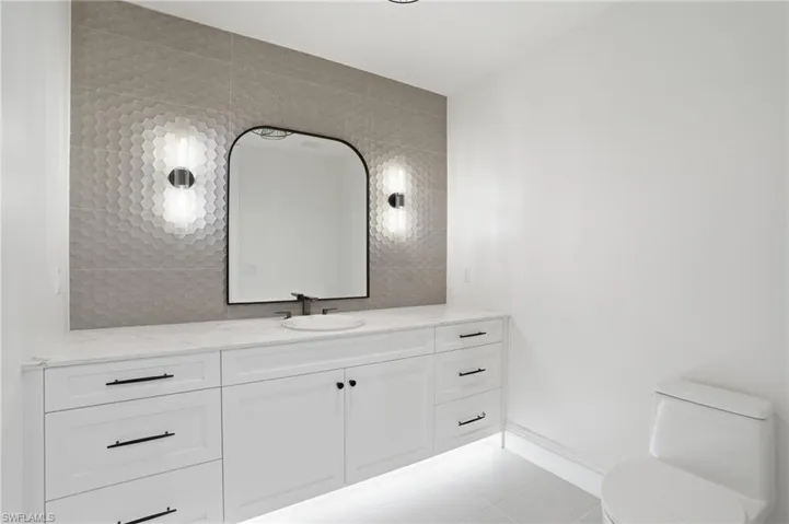 Bathroom featuring vanity and light tile patterned flooring