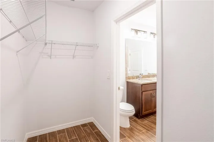 Spacious closet featuring sink