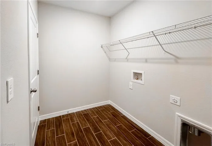 Laundry room featuring hookup for an electric dryer and hookup for a washing machine