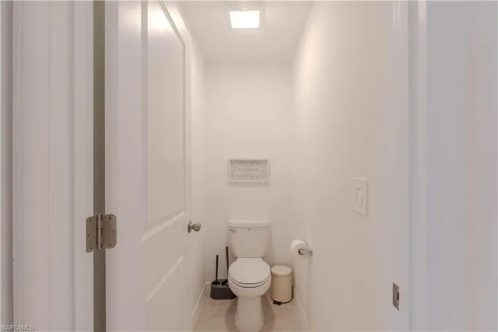 Bathroom featuring tile patterned flooring and toilet