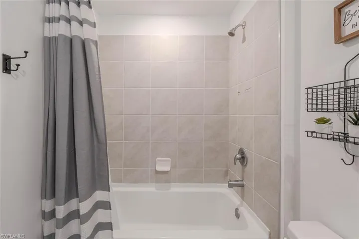 Full bath with shower / bath combo and toilet