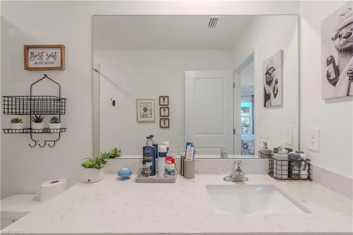 Full bath featuring vanity