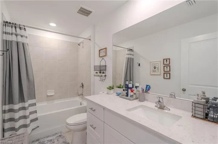 Full bathroom with vanity and shower / tub combo