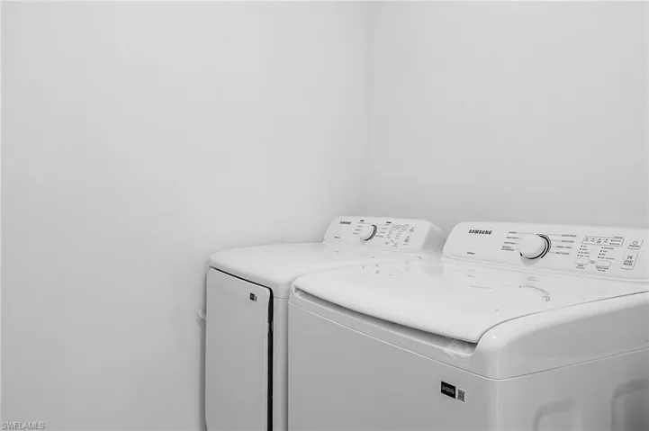 Laundry room with washing machine and dryer