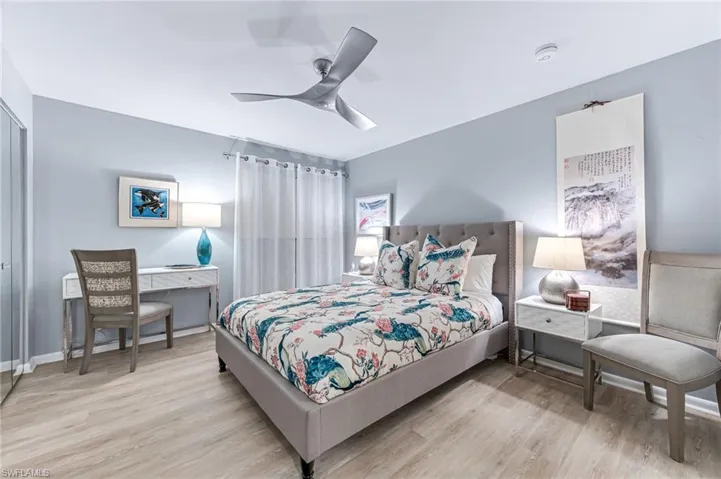 Bedroom featuring light hardwood / wood-style flooring and ceiling fan