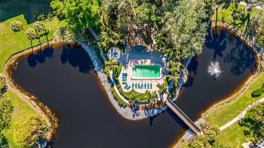 aerial view featuring a water around the amenity area