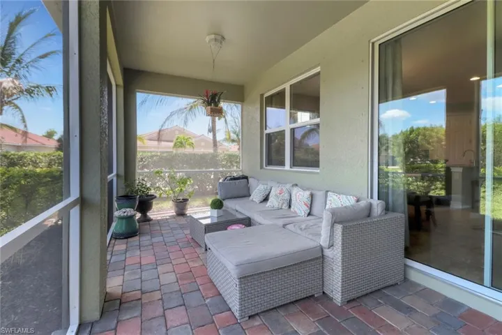Sunroom featuring an outdoor living space