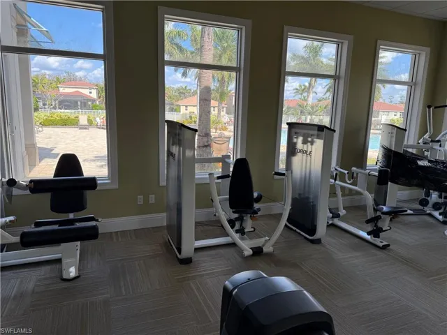 Gym featuring baseboards and carpet flooring
