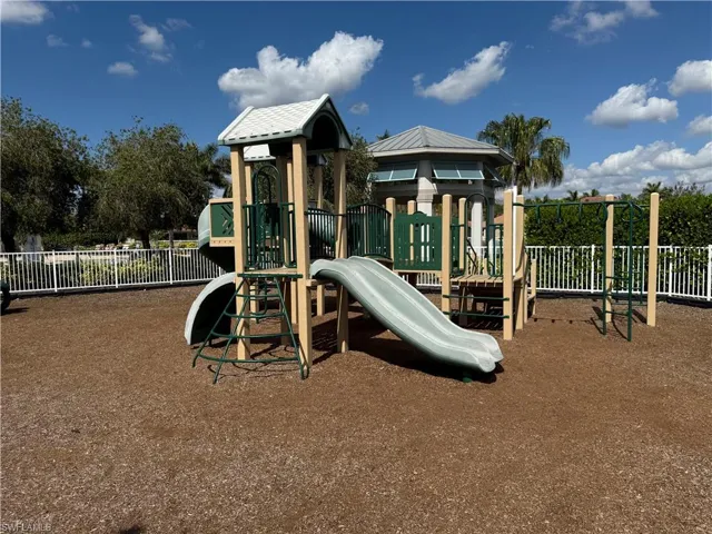 Community play area featuring fence
