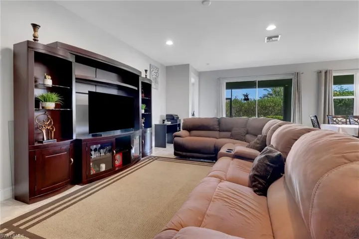 Living area featuring visible vents and recessed lighting