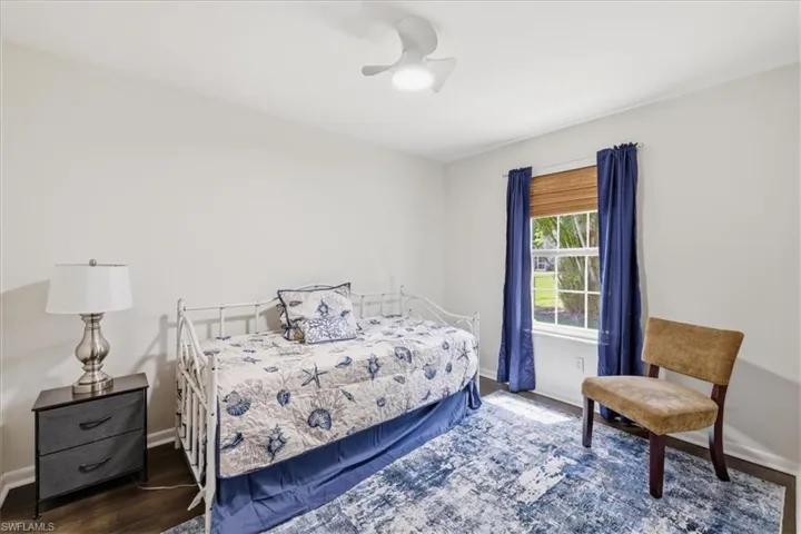 Bright room with wood-finish flooring and neutral wall tones
