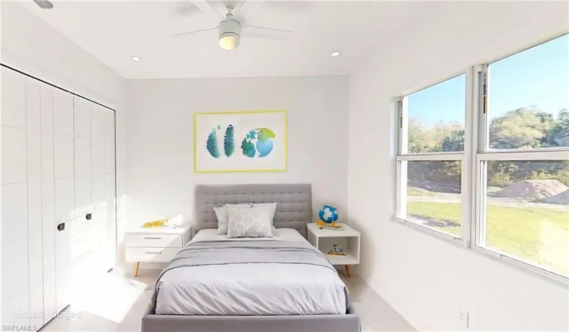 Bedroom with a closet, baseboards, a ceiling fan, and recessed lighting