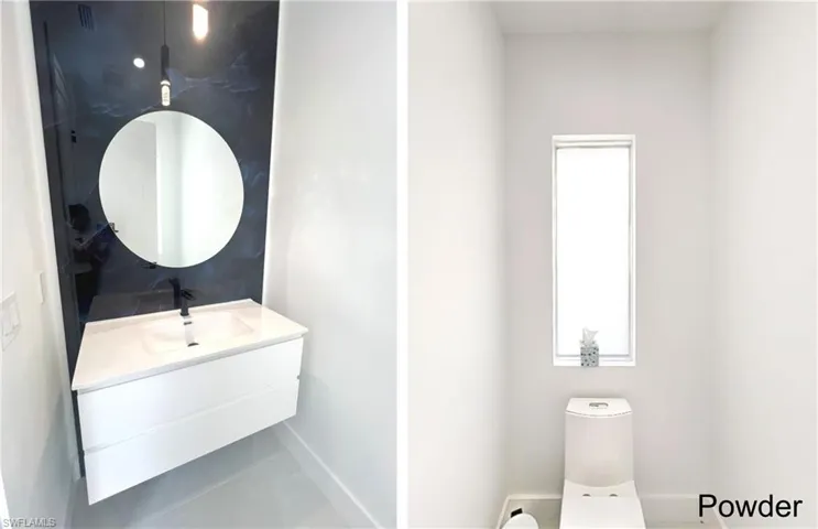 Bathroom featuring toilet, vanity, and baseboards