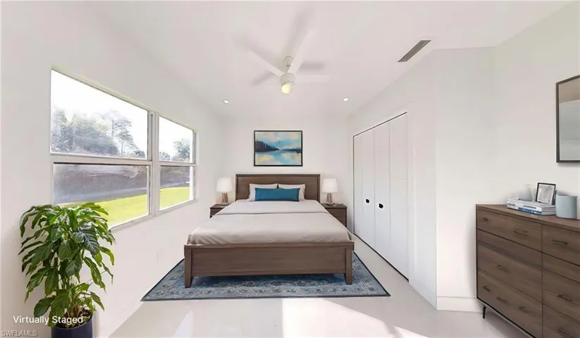Bedroom with a closet, ceiling fan, and recessed lighting