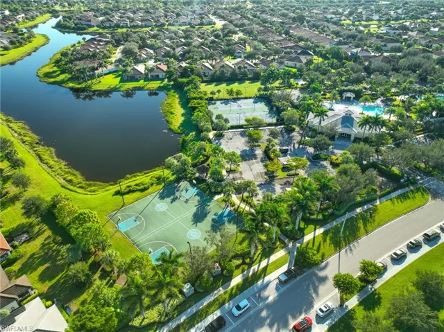 Aerial view of residential area featuring a large body of water