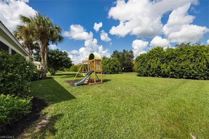 View of green lawn with a playground