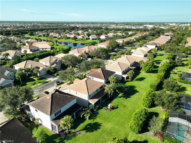 Aerial view of residential area with a large body of water