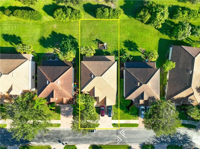 Aerial perspective of suburban area featuring property parcel outlined