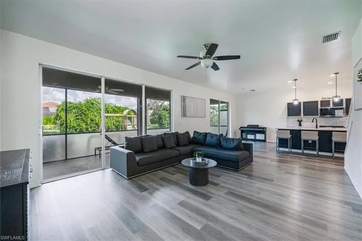 Living area featuring wood finished floors and ceiling fan