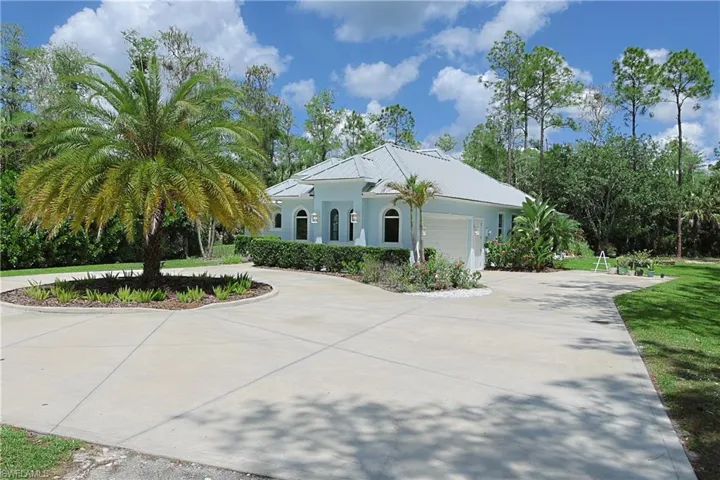 Light blue exterior with a light-colored metal roof