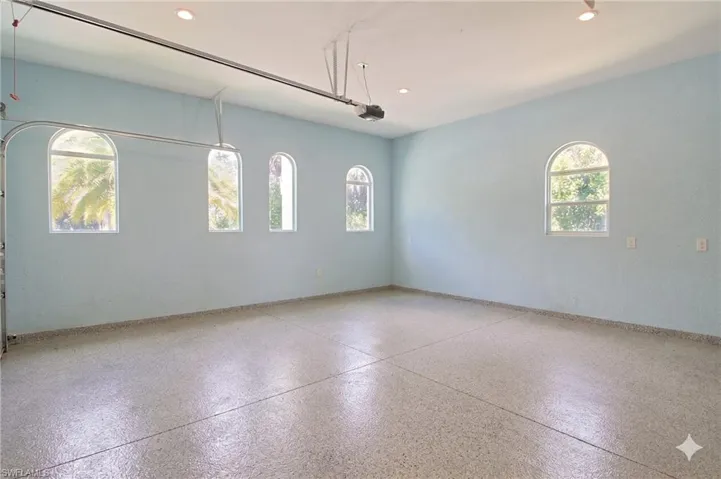 Spacious interior with terrazzo flooring and light blue walls