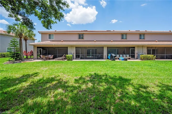 Expansive green lawn with mature landscaping