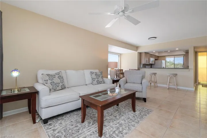 Living Room – Light tile flooring and ceiling fan.