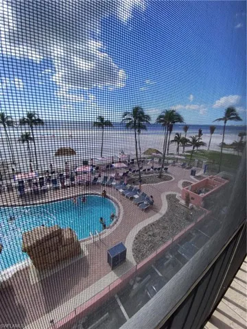 View of swimming pool featuring a water view