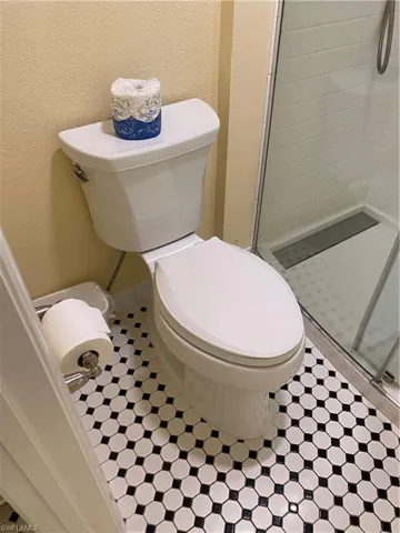 Bathroom featuring toilet and walk in shower