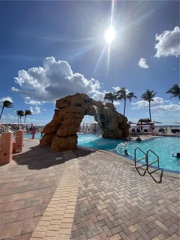 View of swimming pool featuring pool water feature