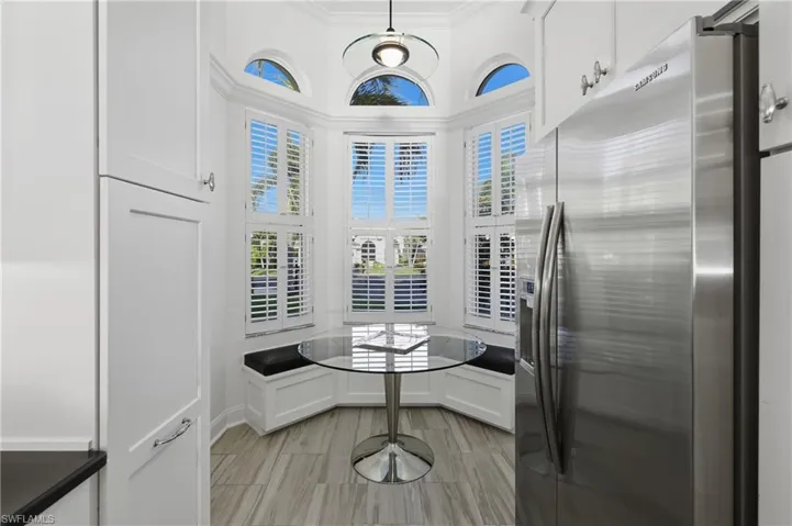 Kitchen with built in seats & storage.